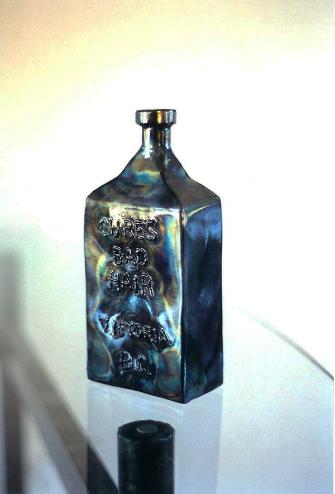 cures hair bottle, flamingsteel.com, steel sculpture, roy mackey