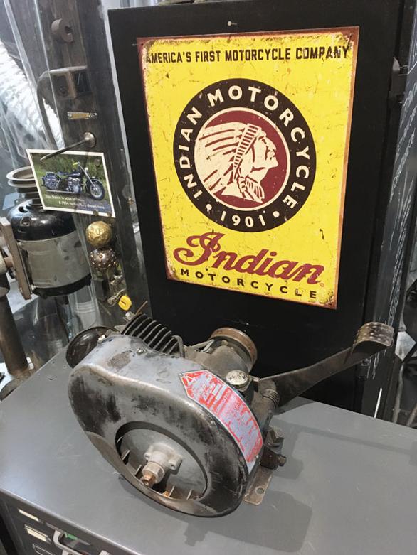 indian motorcycle sign, vintage gas engine, artist studio